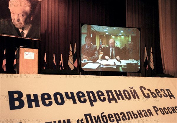 Moscow, russia, june 14, 2003, boris berezovsky (on screen, centre) delivering a report via tv bridge from london for the special congress of the liberal russia party, held at the kosmos hotel in moscow.