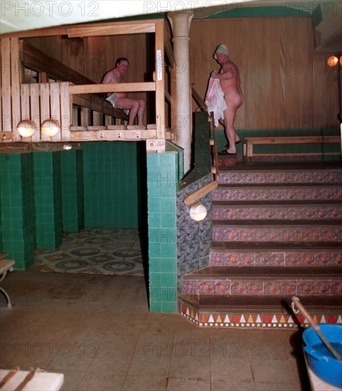 Two men inside the sanduovskiye bathhouse, popularly known as sanduny, the bathhouse is 105 today, it was named after a known russian actor sila nikolayevich sandunov and was made famous by its visitors actors, writers, public figures, moscow, russia, february 13, 2001.