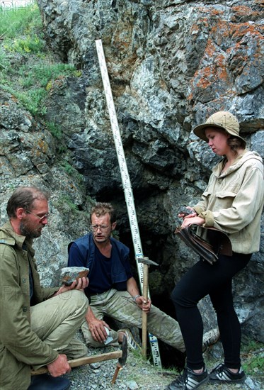 Chief of the bashkir geologic party i,andreyev (l) and geologists a, burdakov and s, sergeyeva (r) pictured estimating the prospected kalkanovsky chromium ore field in uchaltinsky district of bashkiria in the transural region famous for the mineral resourses, the the chromium field was prospected by the geologists of the 'bashkir institute of mineral raw materials', august 1999.