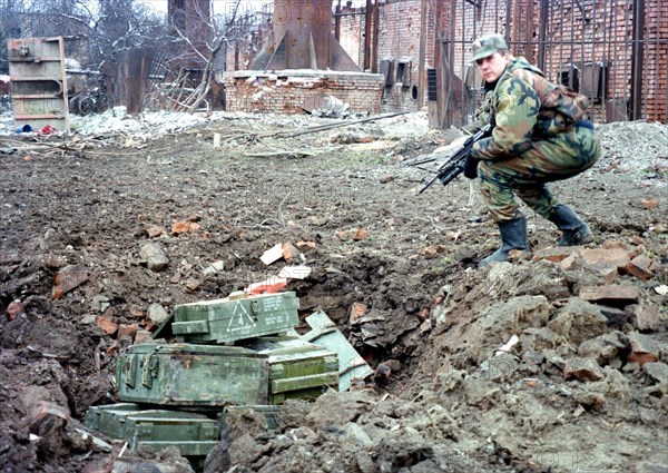 A russian sapper prepares to destroy mines and shells found at house wreckages in the chechen capital of grozny, during the last 24 hours about 2,000 mines and fougasses have been found and defused in grozny, chechnya, russia, march 2, 2000.