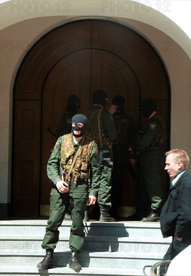 Moscow, russia, may 11, 2000, the tax police officers wearing masks seen at the entrance of the office of media-most holding, headed by vladimir gusinsky, where searches were made in connection with criminal case 285, part two, instituted against former leaders of the russian finance ministry, on thursday.