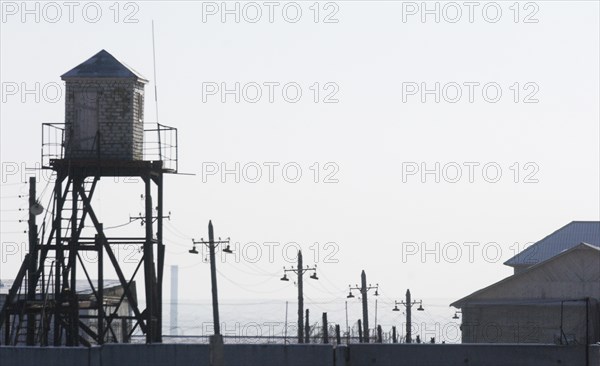 Chita, russia, january 26, 2006, a watch tower and barbed wire fence of the chita prison camp #3, where mikhail khodorkovsky, the former yukos boss, might be transferred to from the krasnokamensk prison camp.