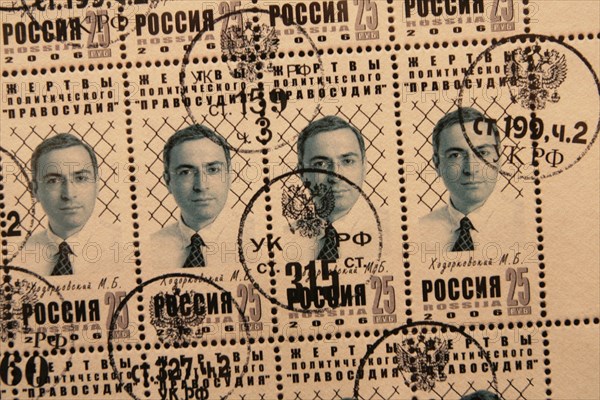 Moscow, russia, february 24, 2006, a post stamp with an effigy of lukoil ex-boss mikhail khodorkovsky, who has been convicted for fraud and tax evasion, is on display at the photo exhibition 'political 'justice' and political prisoners of the present-day russia' hosted by the sakharov museum in moscow.