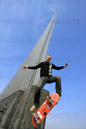 A teenager rides a skateboard at the memorial museum of cosmonautics in peace avenue (prospekt mira), moscow, april 10, 2006.