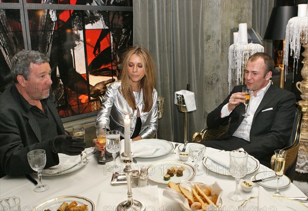 French designer philippe patrick starck (l) is seen at his newly-launched restaurant bon in moscow, pictured at right are andrei melnichenko (r), chairman of the board, mdm bank, and his spouse, moscow, russia, april 2006.