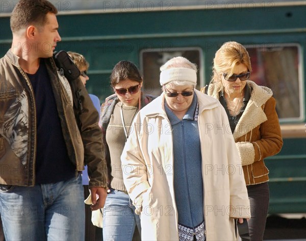 Family of former yukos chief mikhail khodorkovsky - wife inna, mother marina filippovna and daughter nastya (r-l) - have arrived at the railway station after their meeting with jailed oligarch at a penal colony in krasnokamensk in the chita region where he is serving out an eight-year sentence for fraud and tax evasion, september 12, 2006.