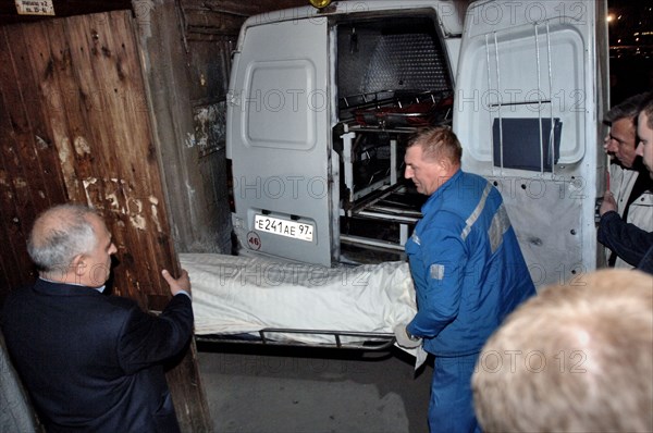 Members of a rescue crew carry out the body of journalist anna politkovskaya, the novaya gazeta special correspondent anna politkovskaya was found shot dead in the hallway of the building where she lived in the centre of the russian capital, moscow, russia, october 7, 2006.