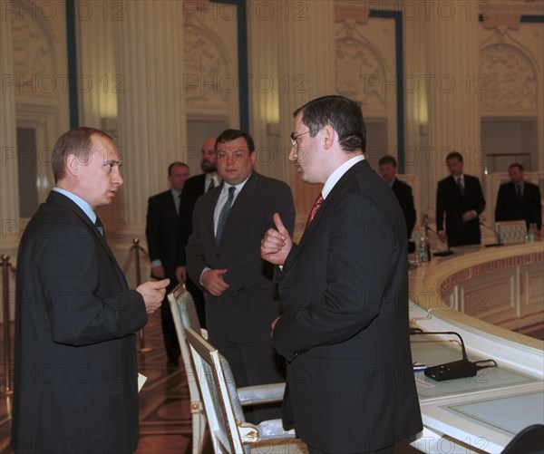 President vladimir putin pictured talking with mikhail khodorkovsky ,the board chairman of the 'yukos' oil company, prior to a meeting with members of the russian union of industrialists and entrepreneurs in the kremlin on thursday ,when the president proposed to discuss tax issues, liberalisation of the currency legislation and russia's joining the world trade organisation, may 31, 2001.