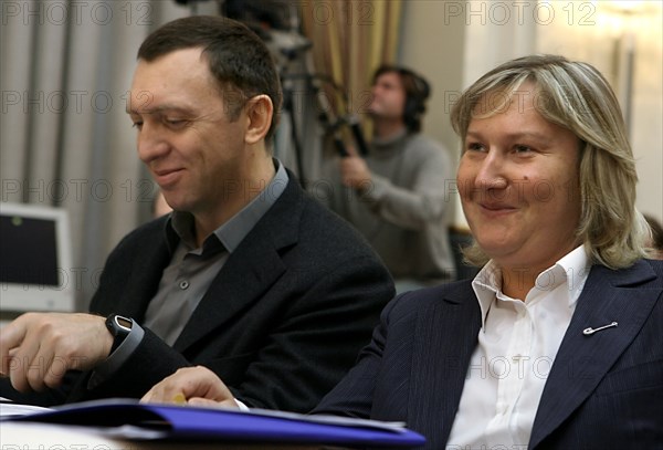 Chairman of the board of rusal oleg deripaska and inteko's owner elena baturina attend the session of the russia's council for the implementation of priority national projects and demographic policy chaired by russian first deputy prime minister dmitri medvedev, november 24, 2006.