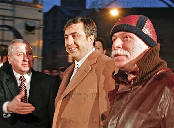 Tbilisi, georgia, december 18, 2006, israeli ambassador to georgia shabtai tsur, georgian president mikhail saakashvili and president of the georgian national olympic committee, business tycoon badri patarkatsishvili, l-r, attend the hanukkah celebration outside the cityi´s synagogue.