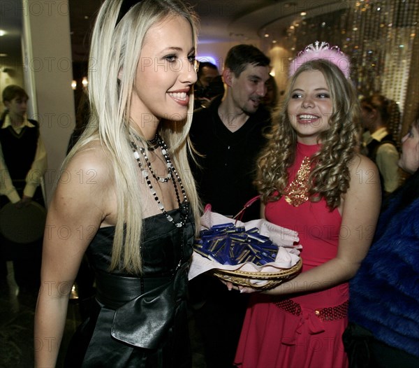 Tv host and socialite ksenia sobchak, left, smiles as she is offered chocolates in the shopping centre 'european' at the russian premiere of william heins comedy pledge this! starring paris hilton, ksenia sobchak is the voice of paris hilton in the comedy released in russia under the title blonde in chocolate, february 8, 2007, moscow, russia.