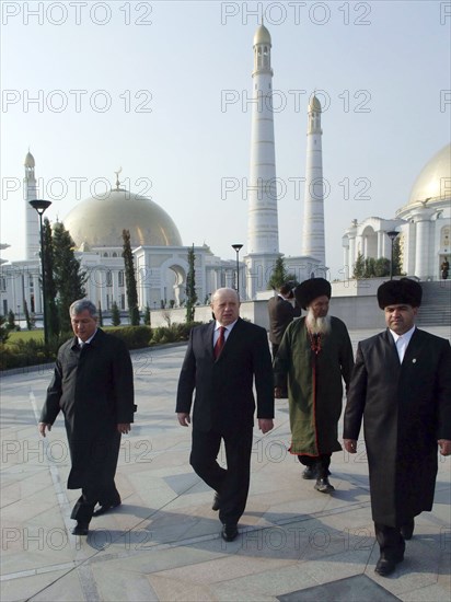 Ashgabat, turkmenistan, february 15, 2007, russian prime minister mikhail fradkov, centre, walks on a visit to the tomb of president of turkmenistan saparmurat niyazov at the mosque called spirit of turkmenbashi.