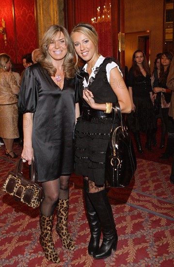 Valentin yudashkin's wife marina (l) and tv host kseniya sobchak pose for a photographer at the party at the metropol hotel after the valentin yudashkin's show at the state kremlin palace, march 9, 2007, moscow, russia.