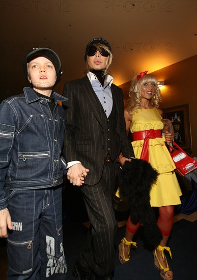 Stylist, singer sergei zverev with son sergei and singer kristina sveshnikova attend shrek the third premiere in oktyabr movie theatre, moscow, russia, may 14, 2007.