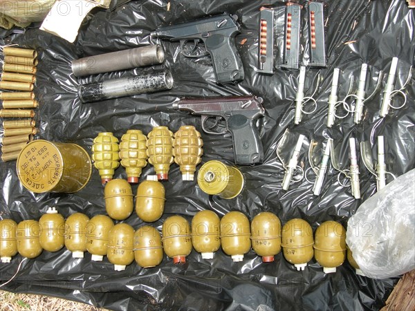 Part of a weapons and ammunition cache uncovered in the chita region of russia, may 29, 2007.