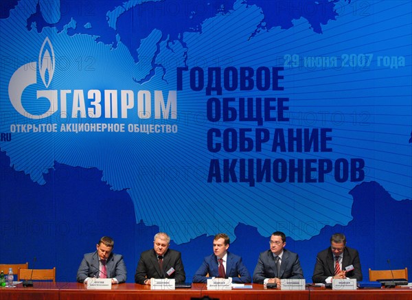 Gazprom deputy chairman, head of gazprom's financial and economic department andrei kruglov, gazprom deputy chairman alexander ananenkov, russia's first deputy pm dmitry medvedev, spokesman for gazprom's chairman sergei kupriyanov, gazprom deputy chairman, gazprom export general director alexander medvedev, l-r, are pictured against the background of gazprom logo at an annual general meeting of gazprom shareholders,  moscow, russia, june 29, 2007.