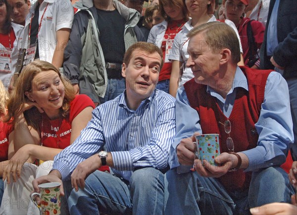 Russia's first deputy pms dmitry medvedev and sergei ivanov, l-r, hold mugs while on a visit to the summer camp of the pro-putin nashi (our people) youth movement at the lake seliger resort, tver region, russia, july 21, 2007.
