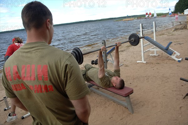 Men exercising at the summer camp of the pro-putin nashi (our people) youth movement at the lake seliger resort, tver region, russia, july 21, 2007.