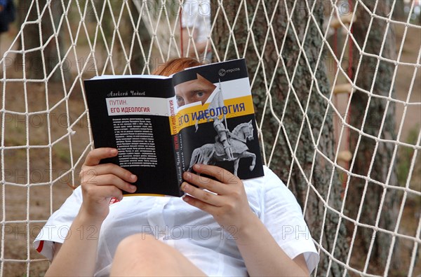 Nashi member reading alexei chadayev's book 'putin: his ideology', his ideologyi´ at the summer camp of the pro-putin nashi (our people) youth movement at the lake seliger resort, tver region, russia, july 21, 2007.