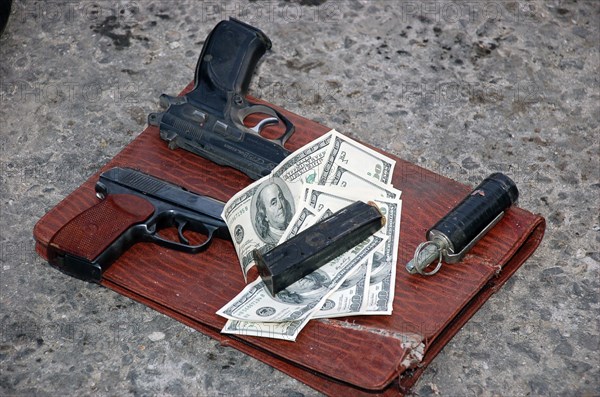 Pistols, a grenade and dollar bills of chechen militant leader musa mutiyev, the so-called 'emir of grozny', musa mutiyev was killed during a special operation in the leninsky district of grozny, chechnya, september 8, 2007.