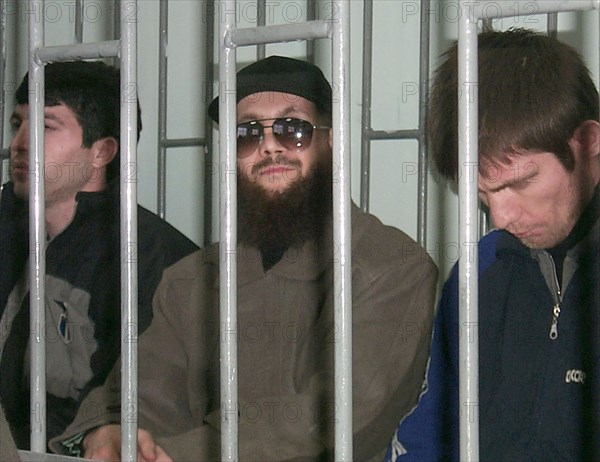 Makhachkala, dagestan, russia, november 15, 2001, chechen terrorist salman raduyev (centre) pictured in the dock, as today, thursday, he and his three accomplices have been put on trial for organization and active participation in a bandit assault on the city of kizlyar and the settlement of pervomaiskoye in dagestan on january 9, 1996 and organization of an explosion at the pyatigorsk railway station in april 1997.