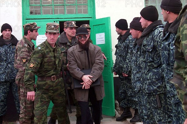 Makhachkala, russia, november 19, 2001, the defendant (c) being taken to his ward during a court hearing interval, the supreme court of the southern republic of dagestan has ended the third day of trial of the chechen field commander salman raduyev and his three accomplices in the raid on the town of kizlyar in 1996.