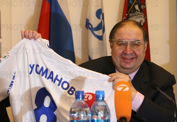 Moscow, russia, february 27, 2008, russian billionaire alisher usmanov who controlls metalloinvest industrial holding company, poses with a jersey bearing his name at a press conference marking metalloinvest's new sponsorship deal with dynamo f,c.