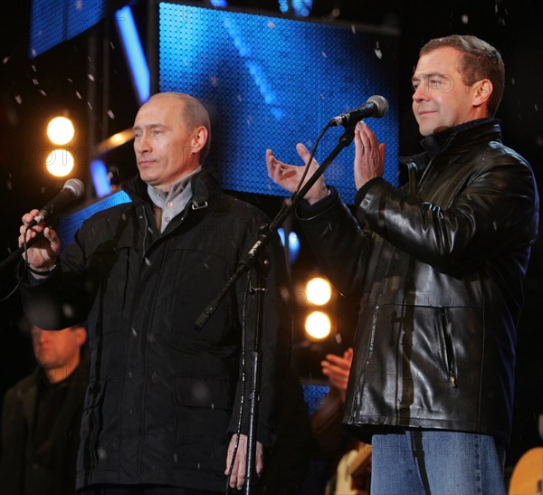 Moscow, russia, march 3, 2008, outgoing president vladimir putin (l) and first deputy prime minister dmitry medvedev address the audience during a concert in vasilyevsky spusk off red square, marking the outcome of the 2008 presidential election.