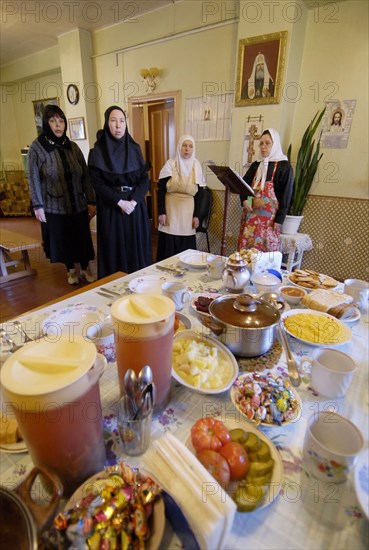 Nuns are praying before having meagre dinner in a frater of the nativity of the holy virgin cathedral in chernogorsk during the lent,  krasnoyarsk territory, russia, march 20, 2008.