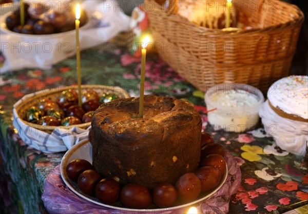 Easter cakes (kulichis), eggs and other food arranged on the table at a church, to be sprinkled with holy water, ivanovo region of russia, april 26, 2008.