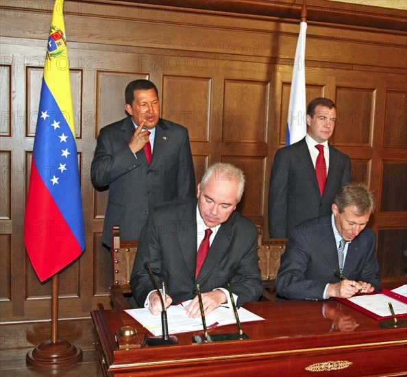 Moscow region, russia, july 22, 2008, rafael ramirez, venezuela's energy minister and head of petr?leos de venezuela, s,a, (pdvsa), the venezuelan state-owned petroleum company, vagit alekperov, president of lukoil, russian oil company, (l-r foreground), venezuela's president hugo chavez and russian president dmitry medvedev (l-r background) appear at an agreement signing ceremony between russia and venezuela at the meindorf residence.