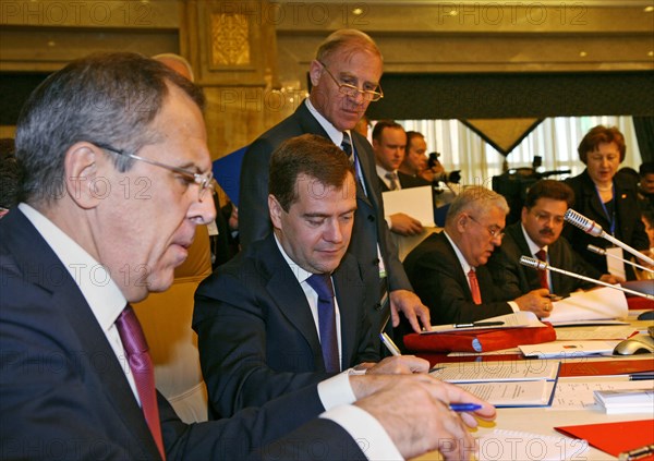 Foreign minister sergei lavrov (foreground) and president of russia dmitry medvedev (background) appear prior to the meeting of the council of the heads of state of the commonwealth of independent states (cis) member countries which is opened at a congress hall of the state residence ala archa, in the capital of kyrgyzstan, bishkek, october 10, 2008.