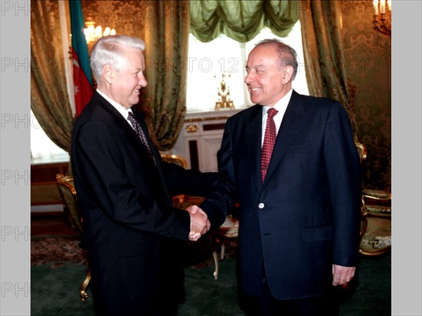 Presidents boris yeltsin of russia /left/ and geidar aliyev of azerbaijan paying an official visit to russia, are pictured shaking hands prior to a one-to-one meeting in the kremlin on jul, 3rd, later the presidents signed a basic treaty of friendship, cooperation and security, along with the treaty, signed at summit level, another five documents were signed in the kremlin in the presence of the heads of state.