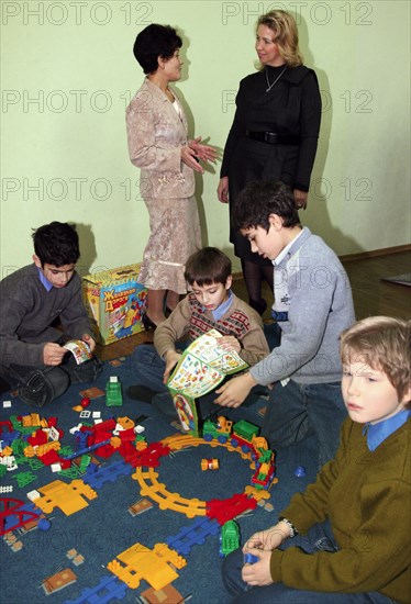 St petersburg, russia, november 3, 2008, school principal lyudmila borovikova and svetlana medvedeva (l-r background), russia's first lady, talk during a visit of the president's spouse to an orphanage/boarding school (number 13).