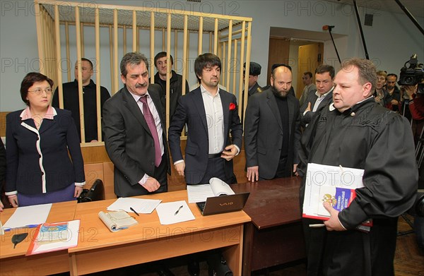 Suspects of murder of journalist anna politkovskaya, pavel ryaguzov and ibragim makhmudov (l-r, background) appear during the hearing of moscow district military court, moscow, russia, november 17, 2008.
