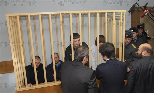 Suspects of murder of journalist anna politkovskaya, pavel ryaguzov, sergei khadzhikurbanov, ibragim makhmudov and dzhabrail makhmudov (l-r) appear at the hearing of moscow district military court, moscow, russia, november 17, 2008.