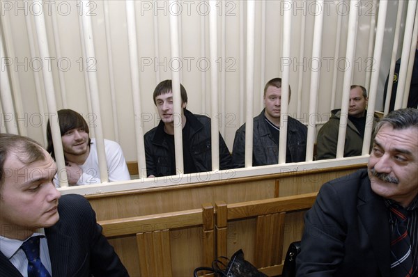 Dzhabrail makhmudov, ibragim makhmudov, pavel ryaguzov and sergei khadzhikurbanov (l-r, background), accused of murdering anna politkovskaya, novaya gazeta columnist, appear at the hearing of moscow district military court, moscow, russia, december 2, 2008.