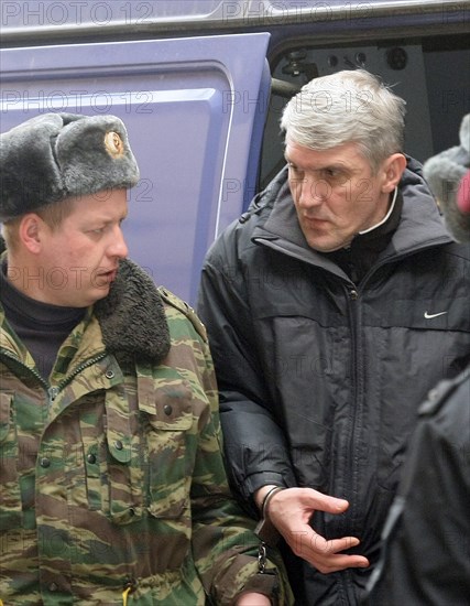 Moscow, russia, march 5, 2009, former head of menatep group, platon lebedev (r), escorted to moscow's khamovniki district court for a preliminary hearing on the new charges of embezzlement and money laundering.