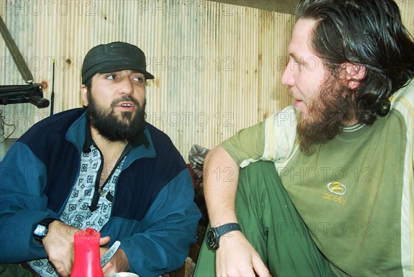 Moscow, russia, july 26, 2002, khattab's right-hand man isayev, aka the 'elsi the red', and achimez gochiyayev (l) seen in the photo made public by the federal secirity service