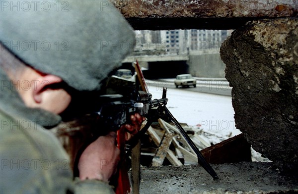 In connection with the tragic accident in daghestan additional security measures were introduced in the city of grozny - the capital of the chechen republic, picture shows a soldier of the internal forces at the checkpoint 'minutka' where terrorists badly wounded general romanov last autumn, january 19, 1996.