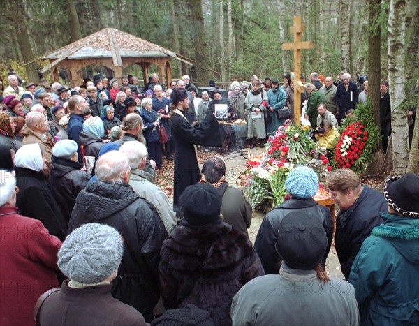 Moscow, russia, october 29, 2000, people holding burning candles attend a mourning service to commemorate the vistims of stalinist repressions on the territory of the former datcha(summer house) of genrikh yagoda, soviet secret police chief, the action was held on the eve of the day of victims of repressions.