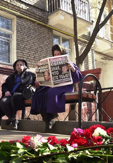 Moscow, russia, april 18, 2003, flowers on the site of murder of state duma deputy and co-chairman of the liberal russia party sergei yushenkov, yushenkov was assassinated in moscow on thursday, the newspaper headline reads: 'yushenkov knew that he was going to be killed'.