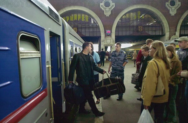 Moscow, russia, august 28, 2003, arriving passengers at kazansky railway station, additional trains were introduced to offset the seasonal flood of passengers, kursky and kazansky railway stations are the busiest ones in moscow nowadays.