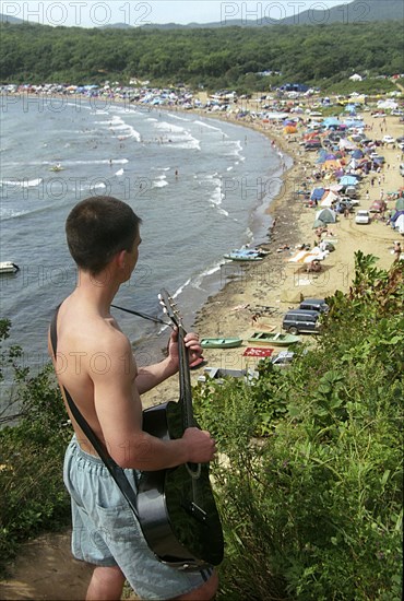 The 26th 'primorie strings' bard songs festival takes place in the 'tri porosyonka' (three little pigs) bay (in picture), bards from siberia and far east gathered here to sing their songs, vladivostok, russia, august 31, 2003.