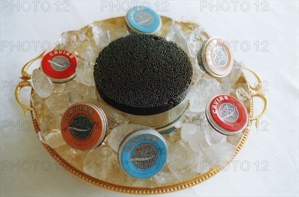 A dish of black caviar with ice, russia.