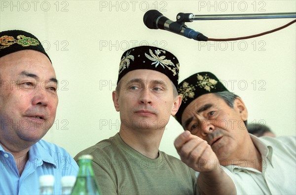 Kazan, tatarstan, russia, june 24 2000, russian president vladimir putin wearing a tatar embroidered skull-cap on his head seen attending an open-air holiday events organized outside kazan, sabantui has been traditionally celebrated as a plough holiday marking the end of sowing campaign, now it has become a national holiday marked all over the republic notwithstanding occupation or national identity.