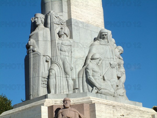 A section of the freedom monument in the center of riga, latvia, 2003, the monument was designed by sculptor k,zale and unveiled in 1935, scenes of latvia's struggle for independence are depicted around the base.