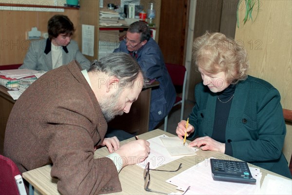 Russian tax payer with a federal tax inspector, moscow, russia, march 2002.