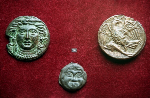 Moscow, russia, 02,99, bronze coins of the 4th century b,c, found in the northern regions of the black sea shore are displayed at the exhibition of the greek and roman coins of the vi-iv c, b,c, opened in the state museum of fine arts named after pushkin in downtown moscow on tuesday , over 1500 different exhibits acquainting with history, economy,culture and religion of ancient greece and rome are displayed at exposition.
