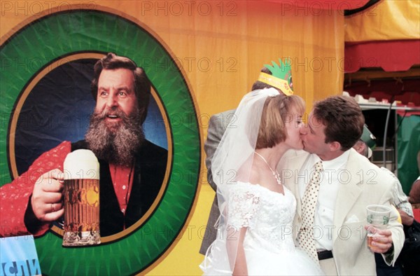 The newly weds fail the tradition and mark their wedding with beer instead of champagne at the grand moscow beer festival opened here today for the first time in luzhniki sports complex, moscow, russia, july 17,1999  .